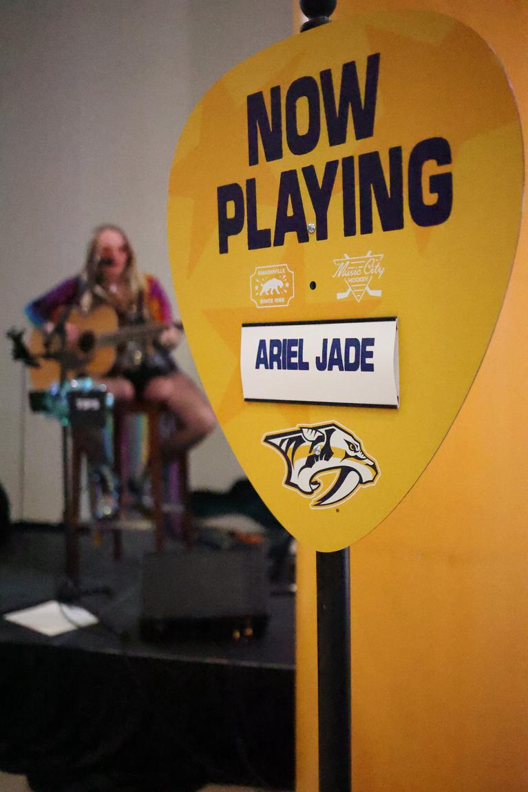Now Playing: Ariel Jade sign at a Nashville Predators event