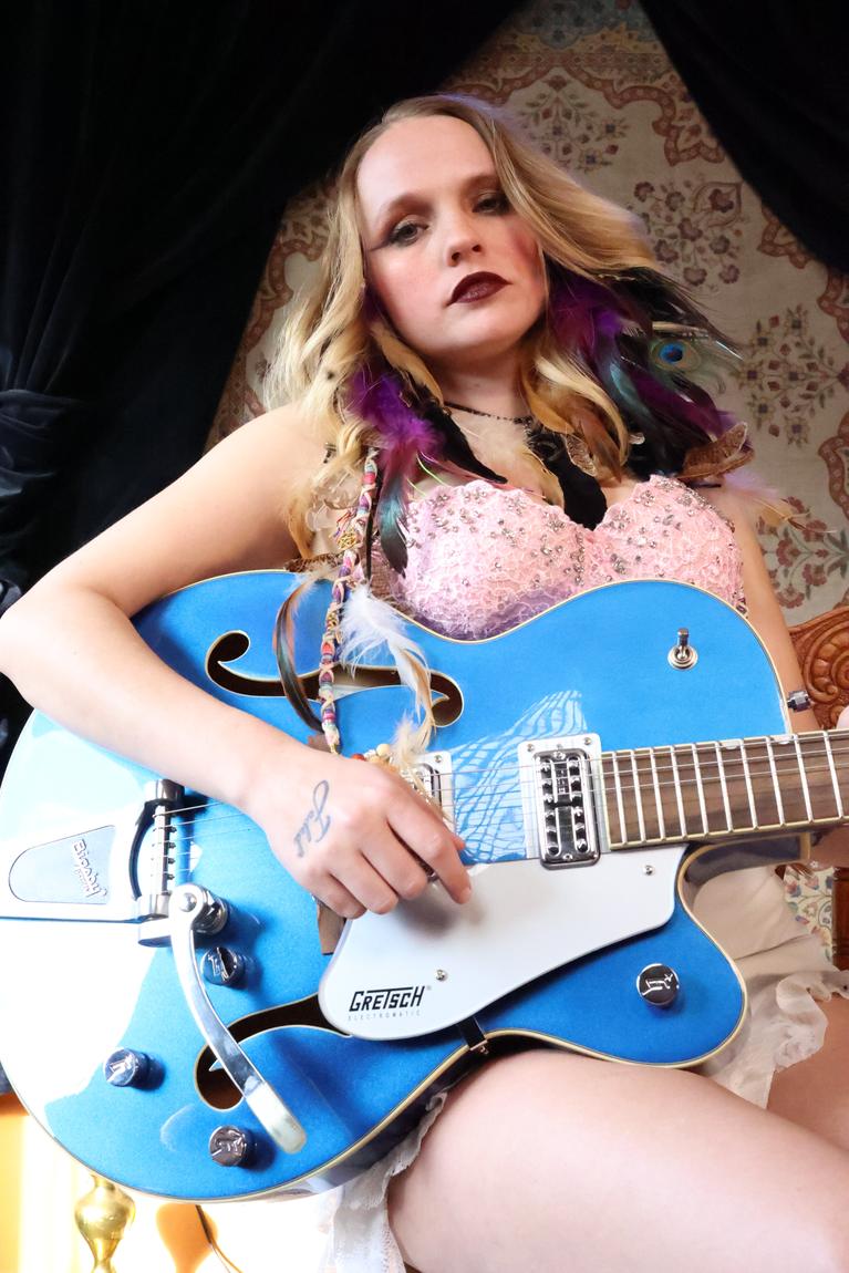 Low-angle portrait of Ariel Jade with her Gretsch