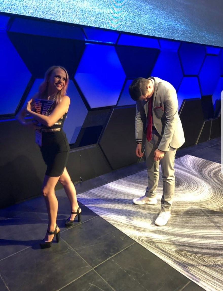 Ariel Jade holding an award on stage